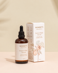 Organic Stretch Mark Serum on a warm beige studio background.