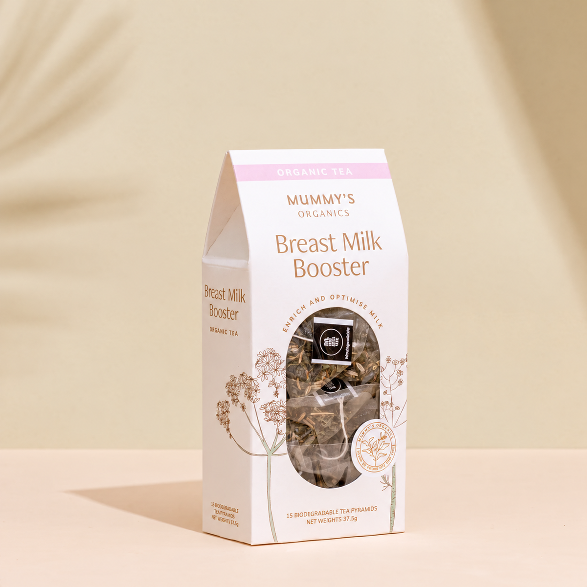 Organic Breast Milk Booster Tea on a warm beige studio background.