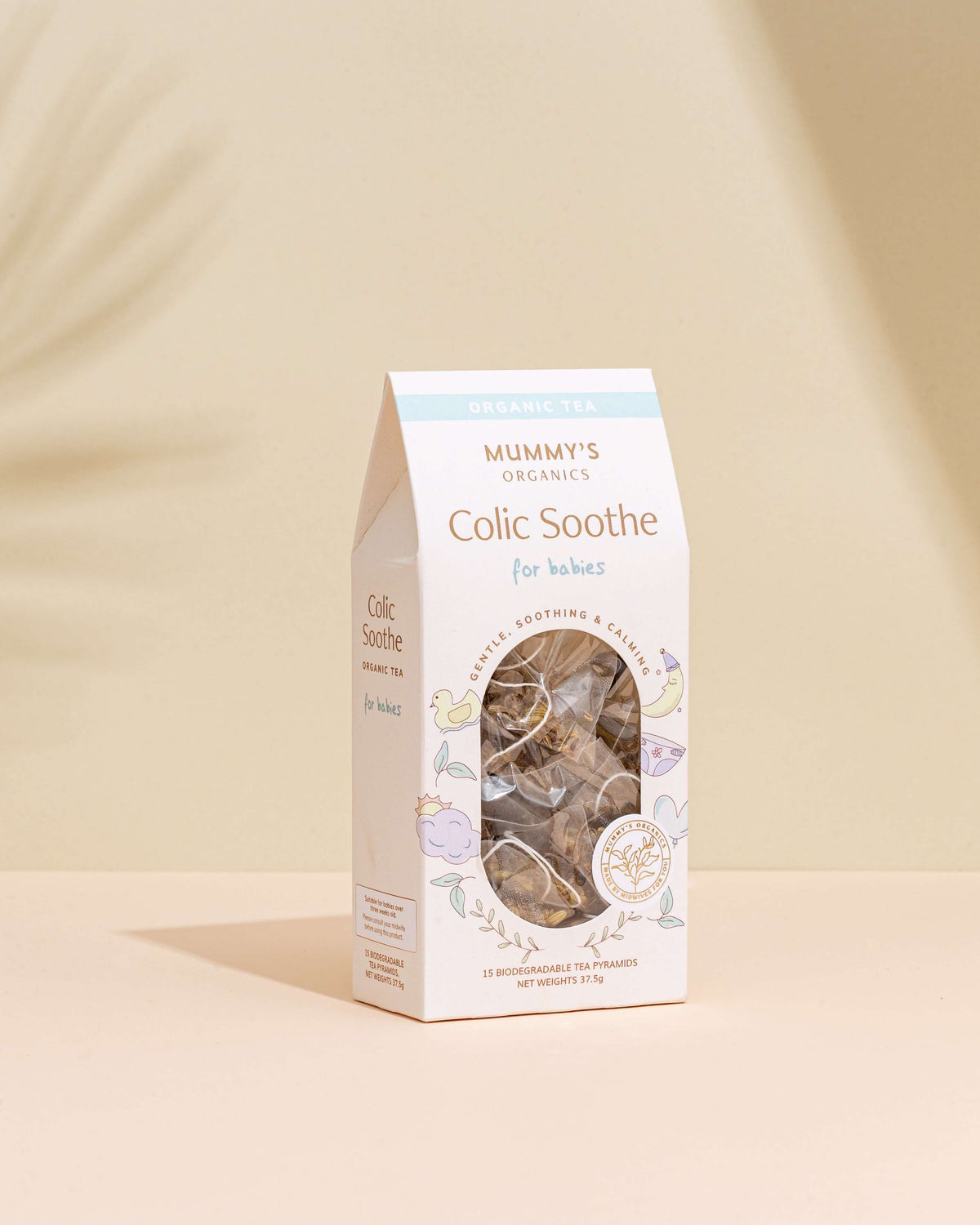 Organic Colic Soothe Tea on a beige and peach background.