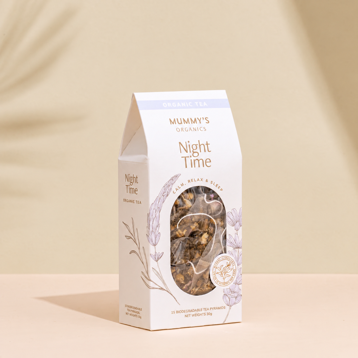 Organic Night Time Tea on a warm beige studio background.