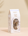 Organic Night Time Tea on a warm beige studio background.