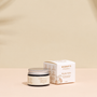 Organic Nipple Balm on a warm beige studio background.