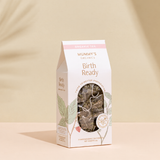 Organic Raspberry Leaf Tea on a warm beige studio background.