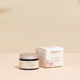 Organic Scar Balm on a warm beige studio background.