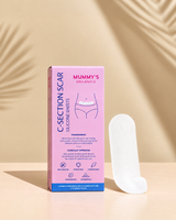 Mummy’s Organics C-Section Scar Silicone Sheets in pink packaging beside a silicone sheet on a warm beige background.